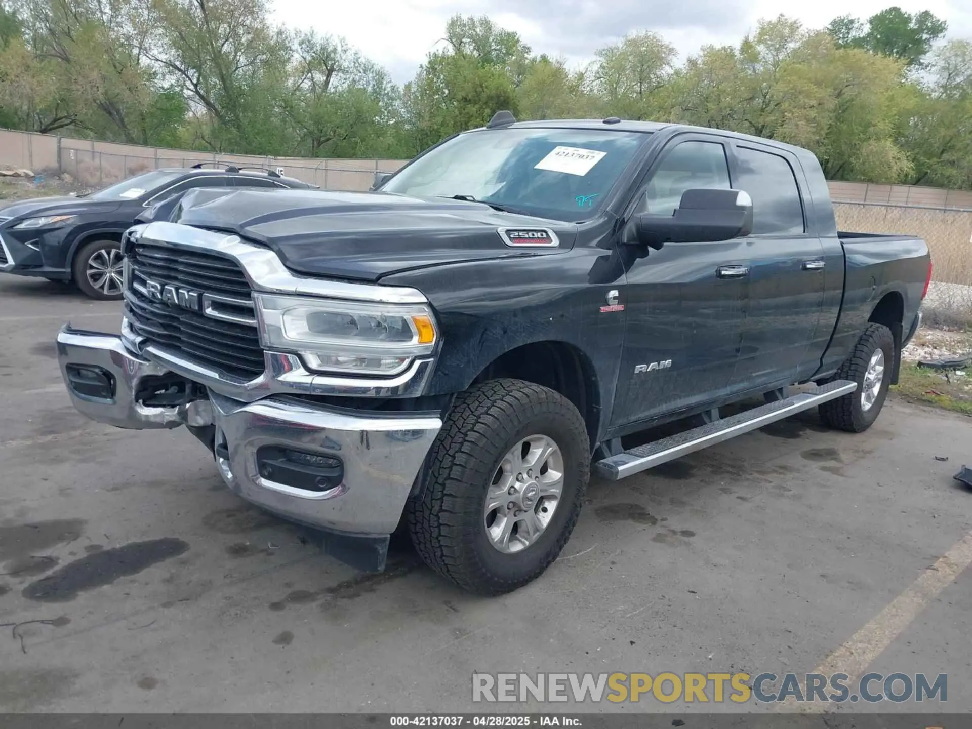 2 Photograph of a damaged car 3C6UR5ML4KG635799 RAM 2500 2019