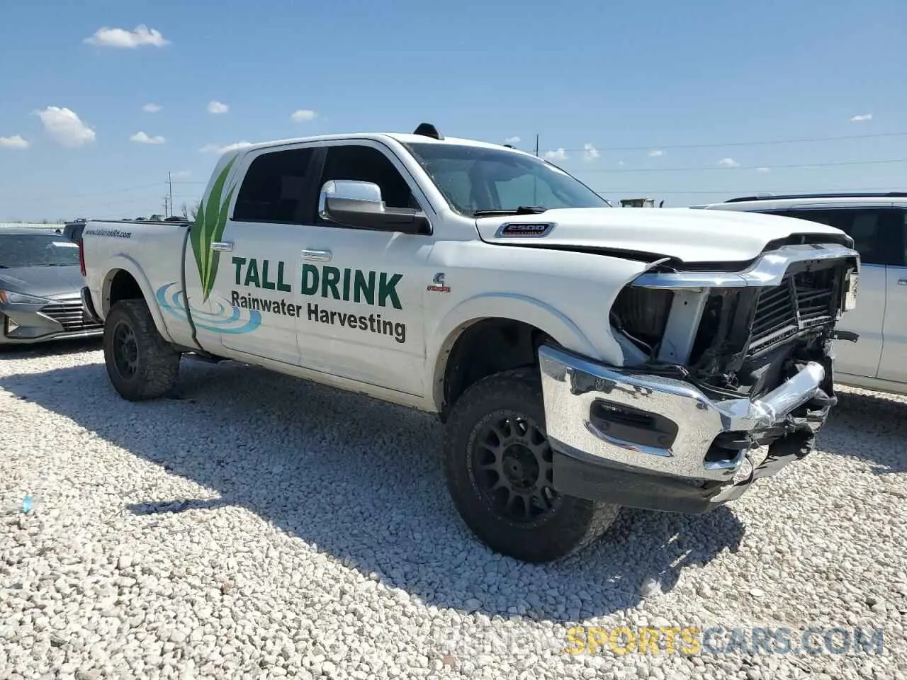 4 Photograph of a damaged car 3C6UR5NL2KG593602 RAM 2500 2019