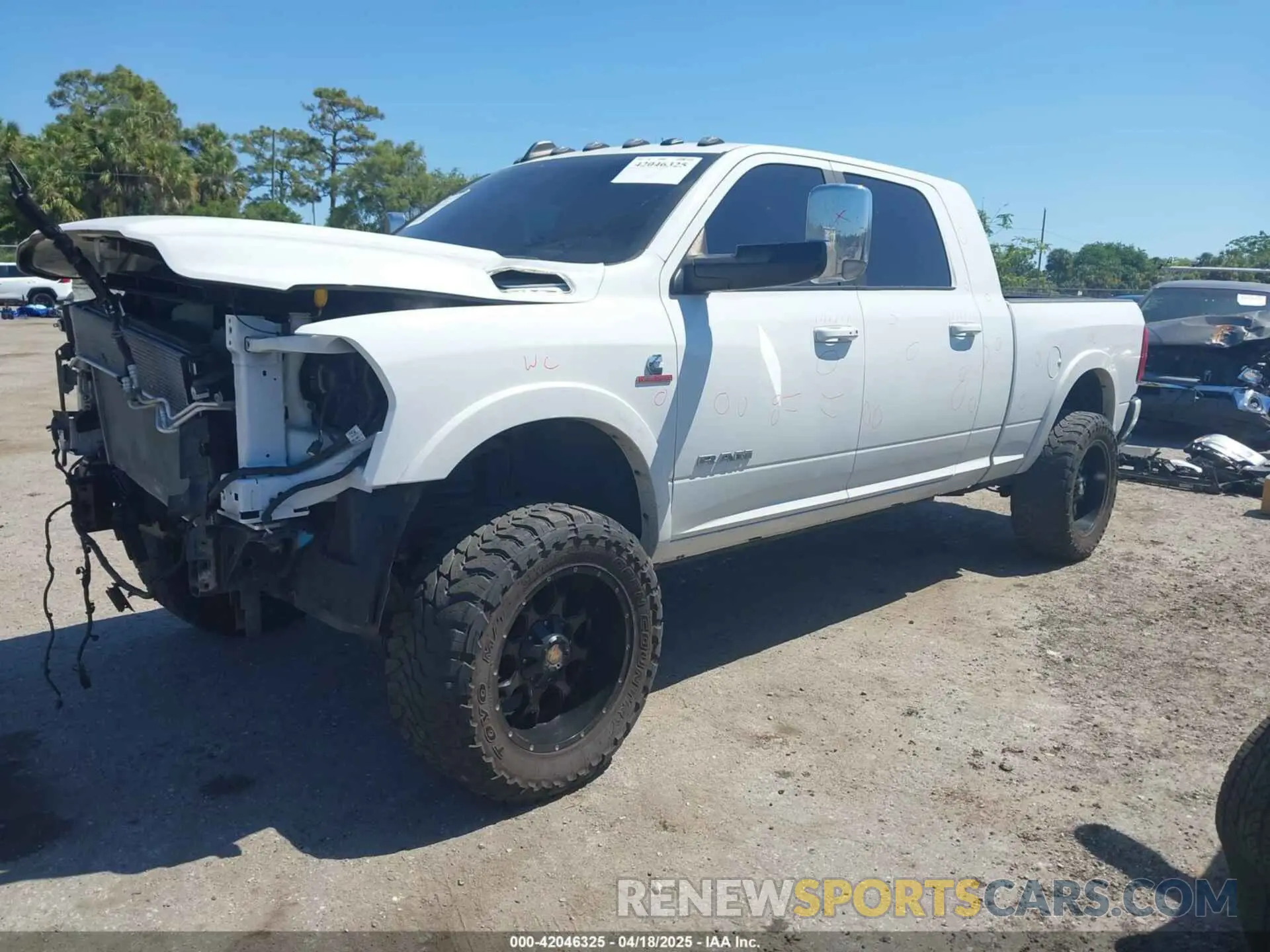 2 Photograph of a damaged car 3C6UR5NL2KG718789 RAM 2500 2019