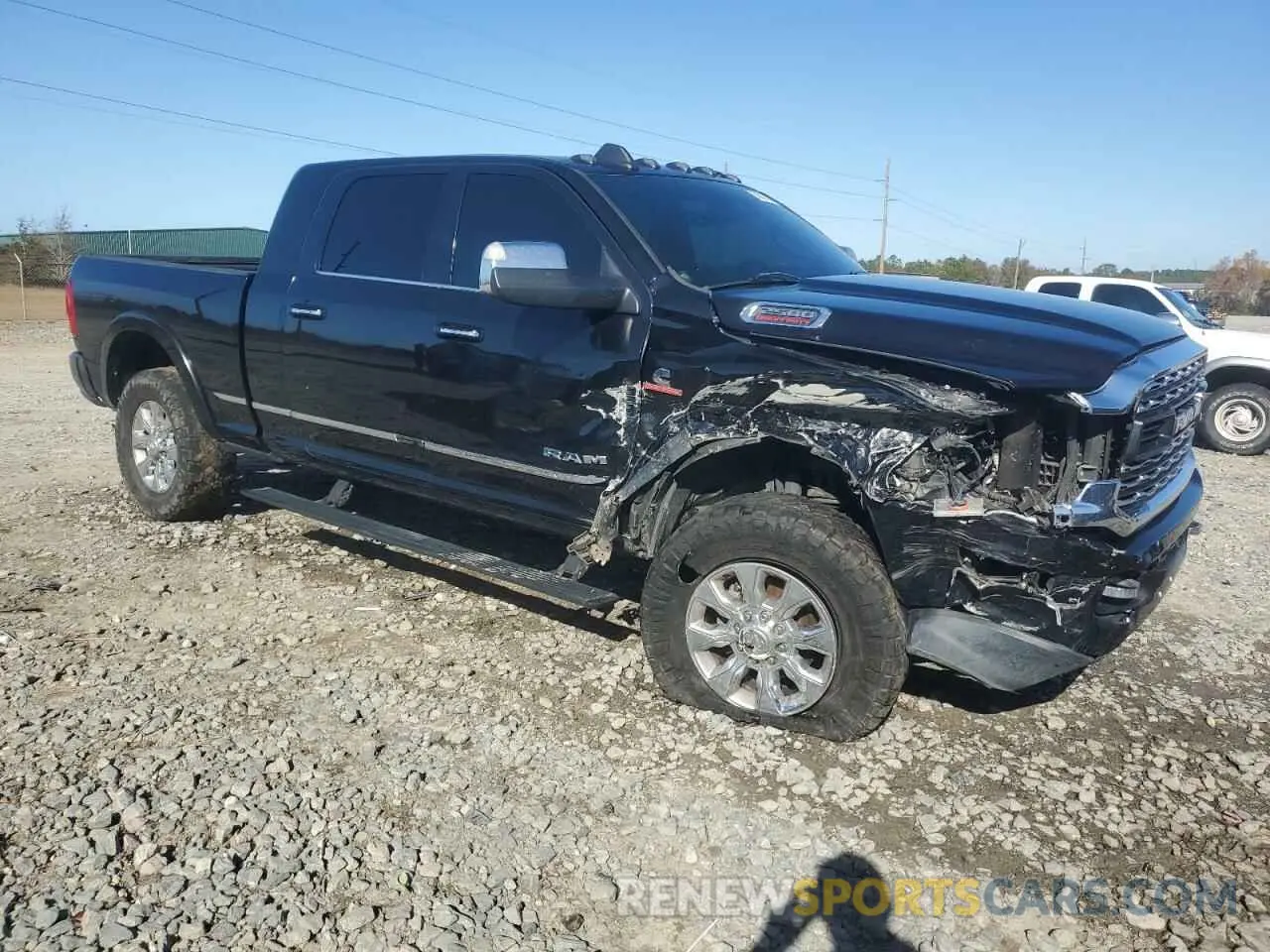4 Photograph of a damaged car 3C6UR5TL5KG540024 RAM 2500 2019