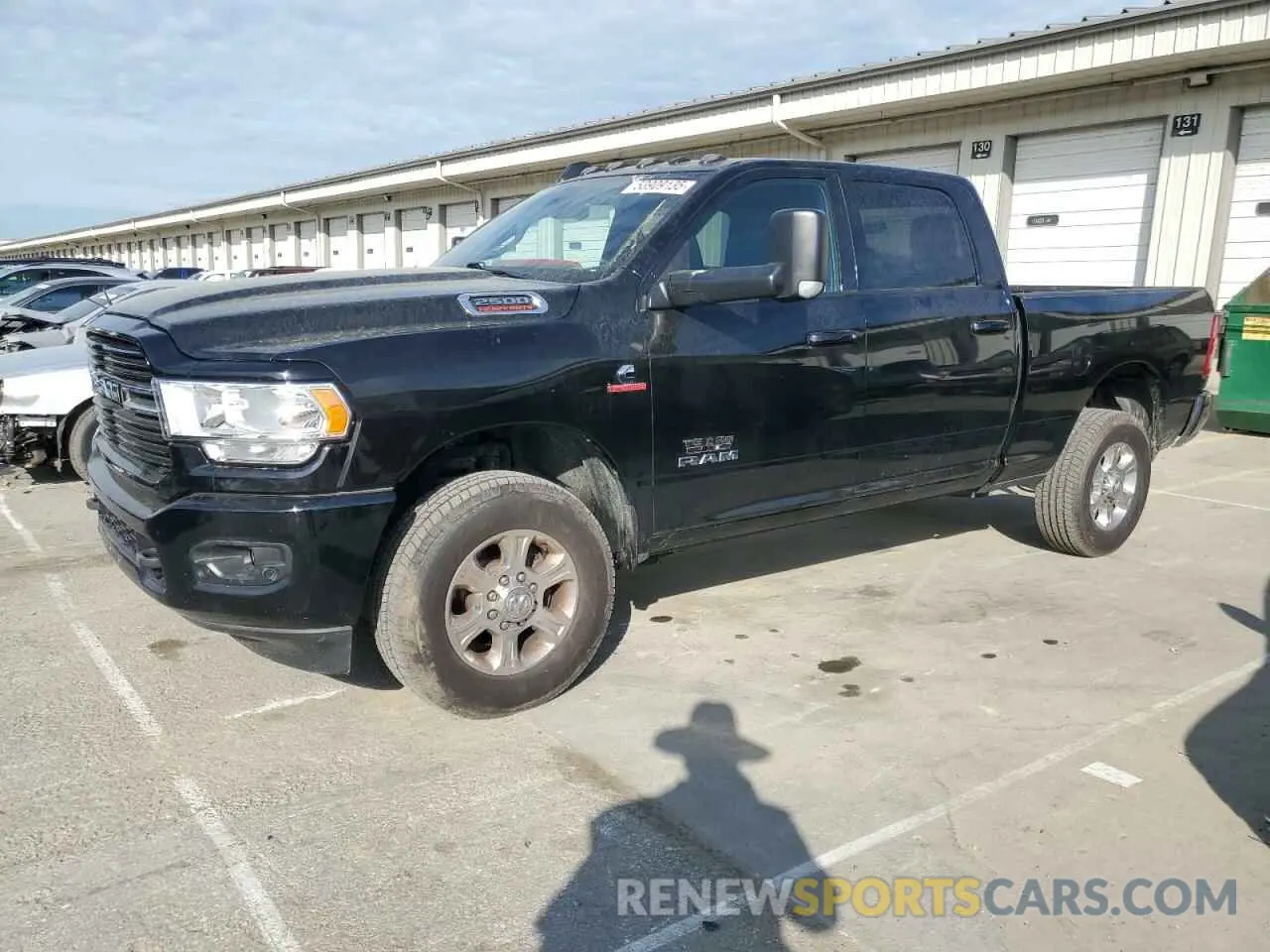 1 Photograph of a damaged car 3C6UR5DL1LG115318 RAM 2500 2020