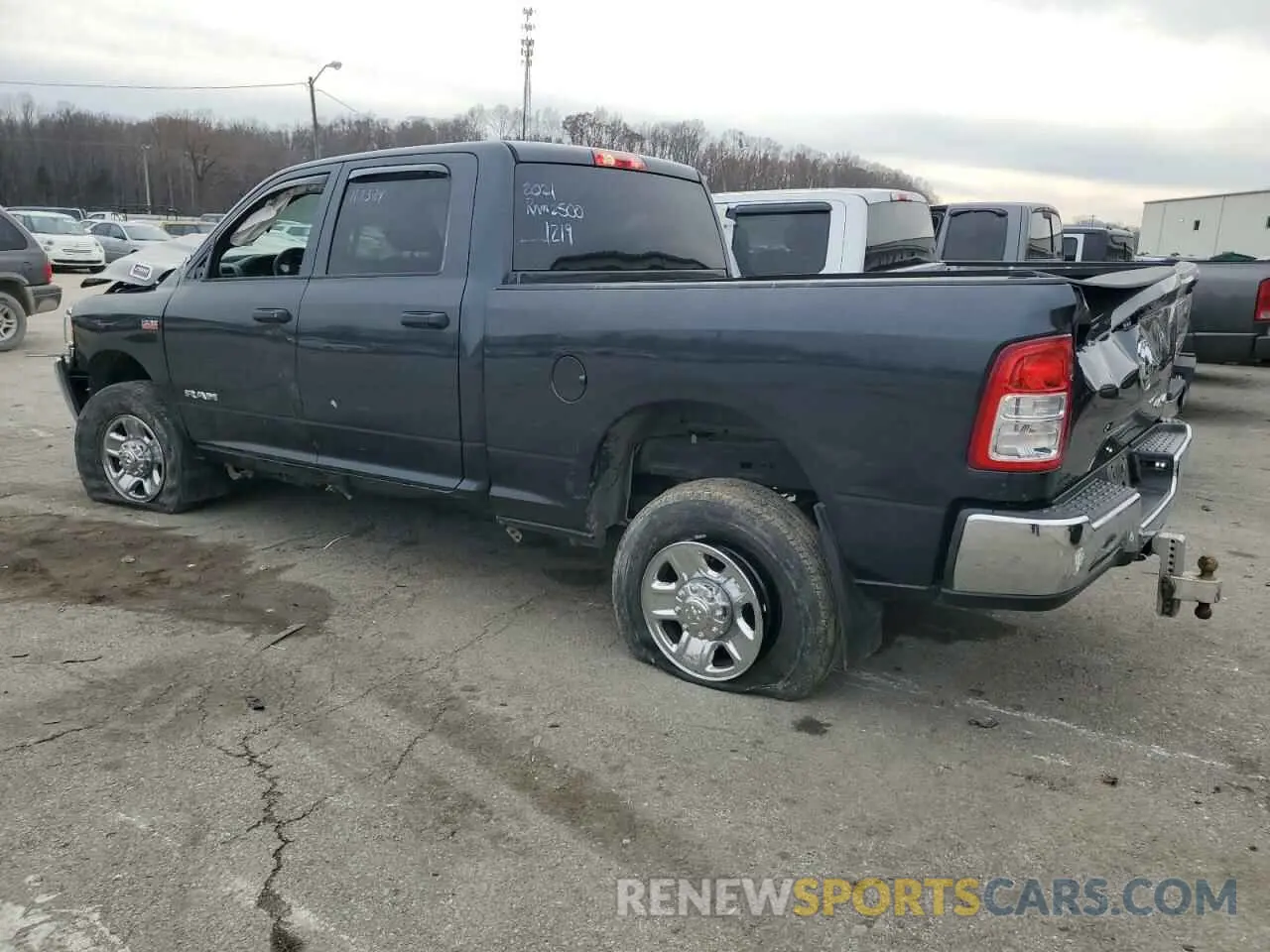 2 Photograph of a damaged car 3C6UR5CJ2MG561219 RAM 2500 2021