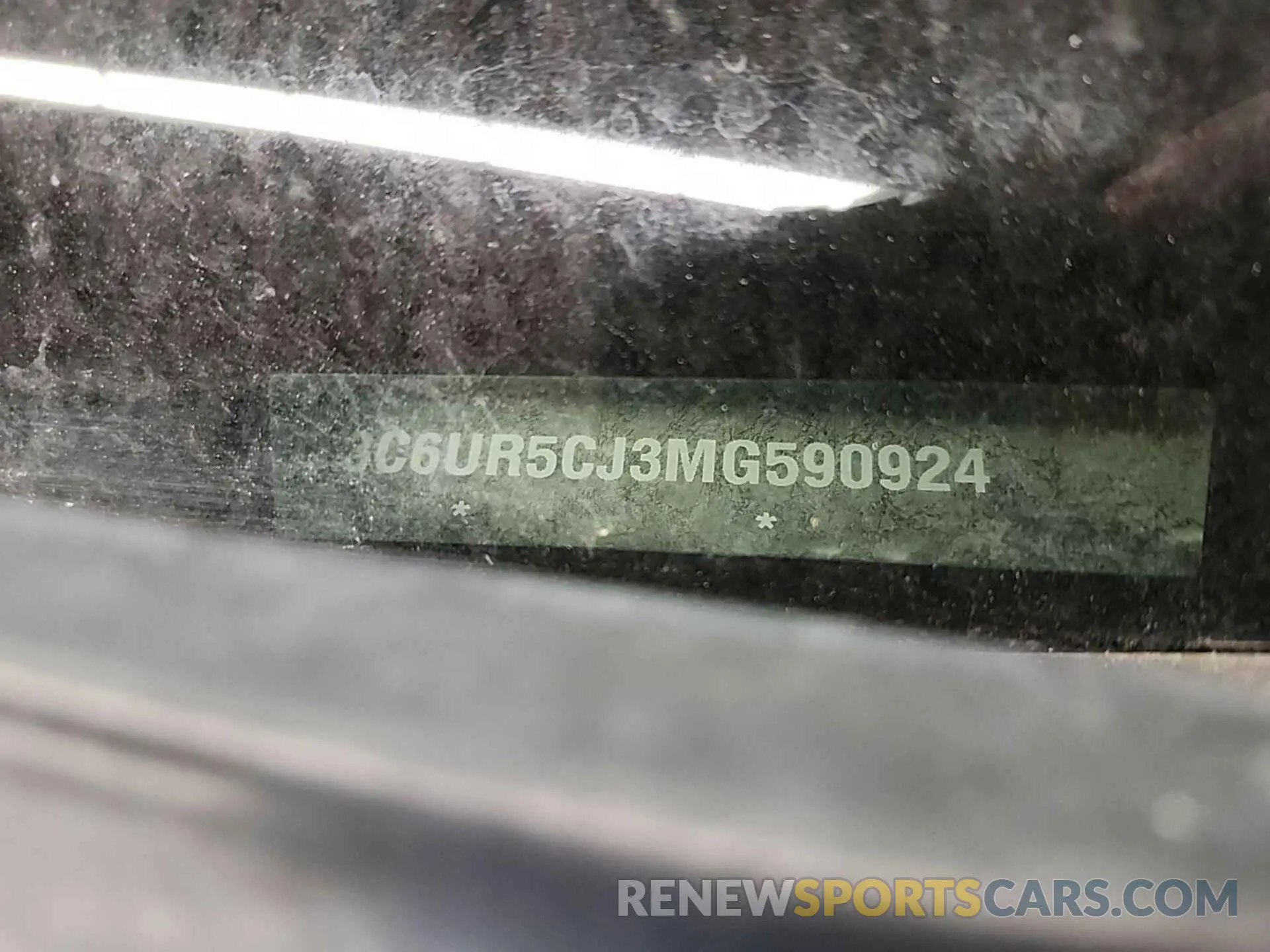 13 Photograph of a damaged car 3C6UR5CJ3MG590924 RAM 2500 2021
