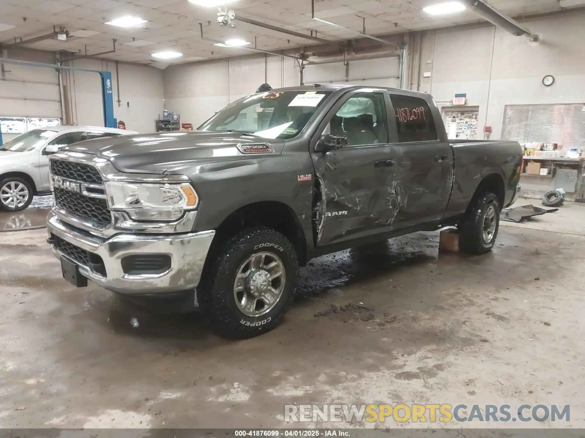 2 Photograph of a damaged car 3C6UR5CJ3MG681322 RAM 2500 2021