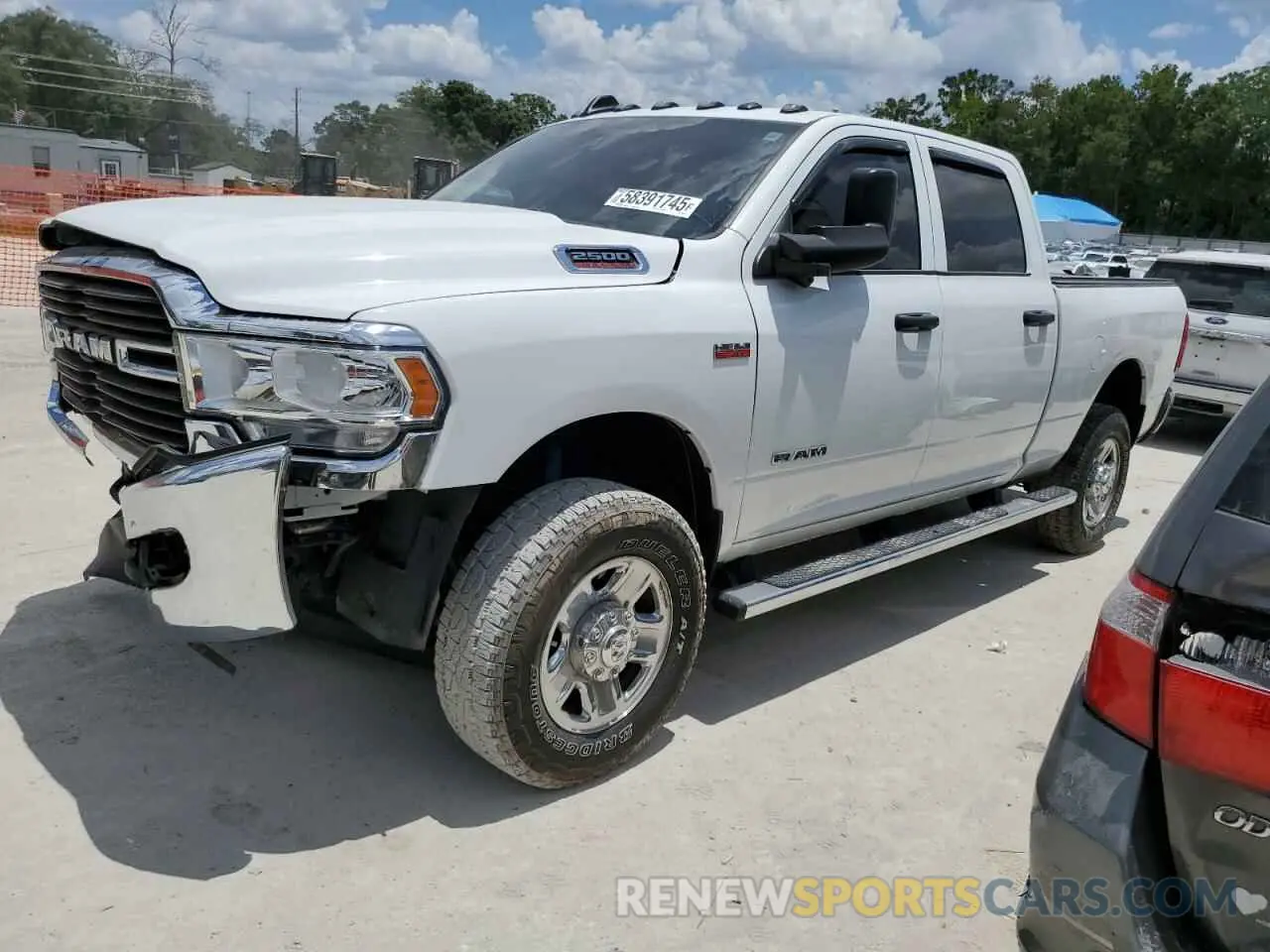 1 Photograph of a damaged car 3C6UR5CJ4MG535303 RAM 2500 2021