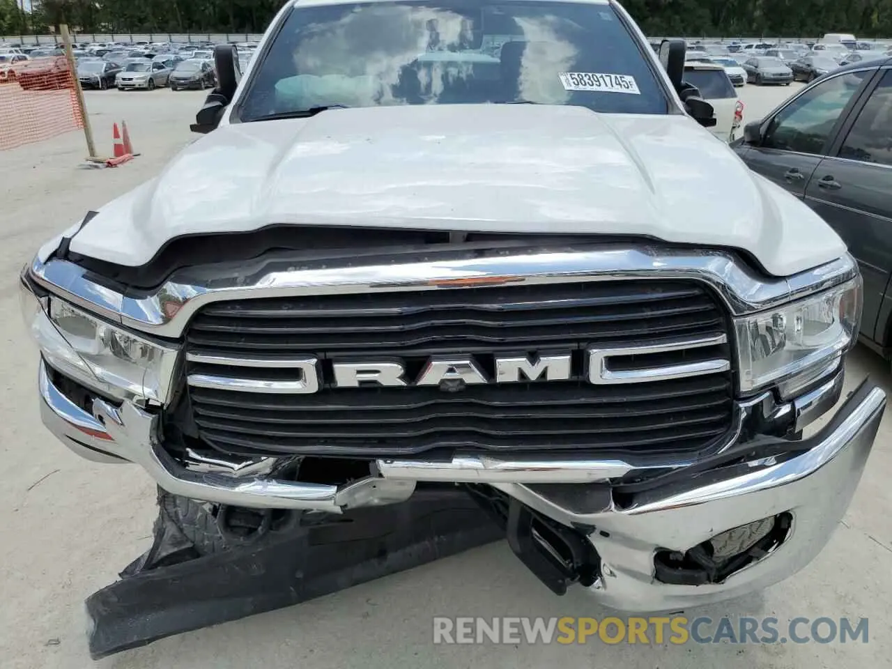 11 Photograph of a damaged car 3C6UR5CJ4MG535303 RAM 2500 2021