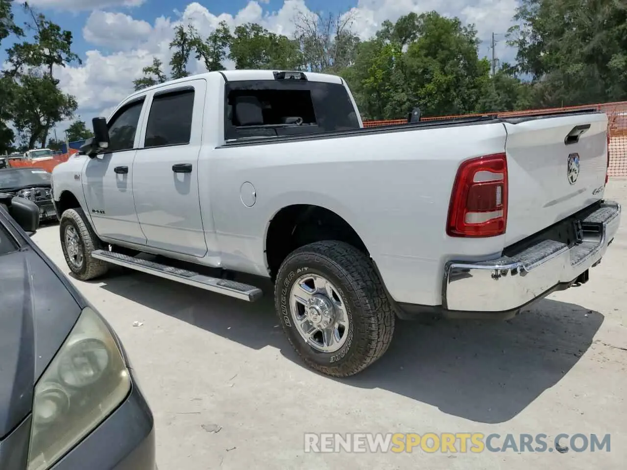 2 Photograph of a damaged car 3C6UR5CJ4MG535303 RAM 2500 2021