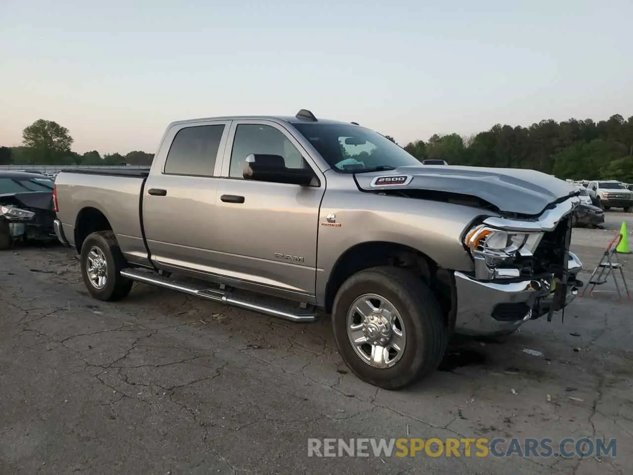 4 Photograph of a damaged car 3C6UR5CL4MG631756 RAM 2500 2021