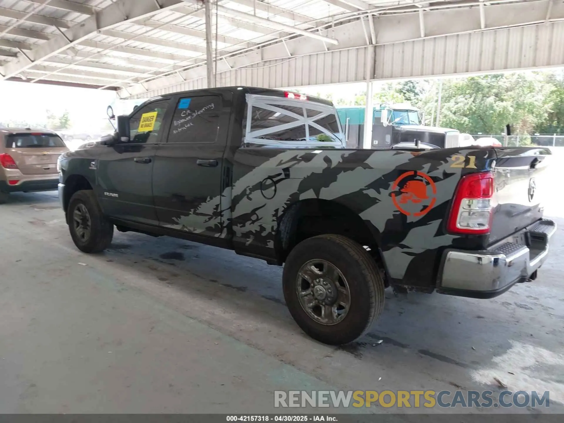 14 Photograph of a damaged car 3C6UR5CL6MG502384 RAM 2500 2021