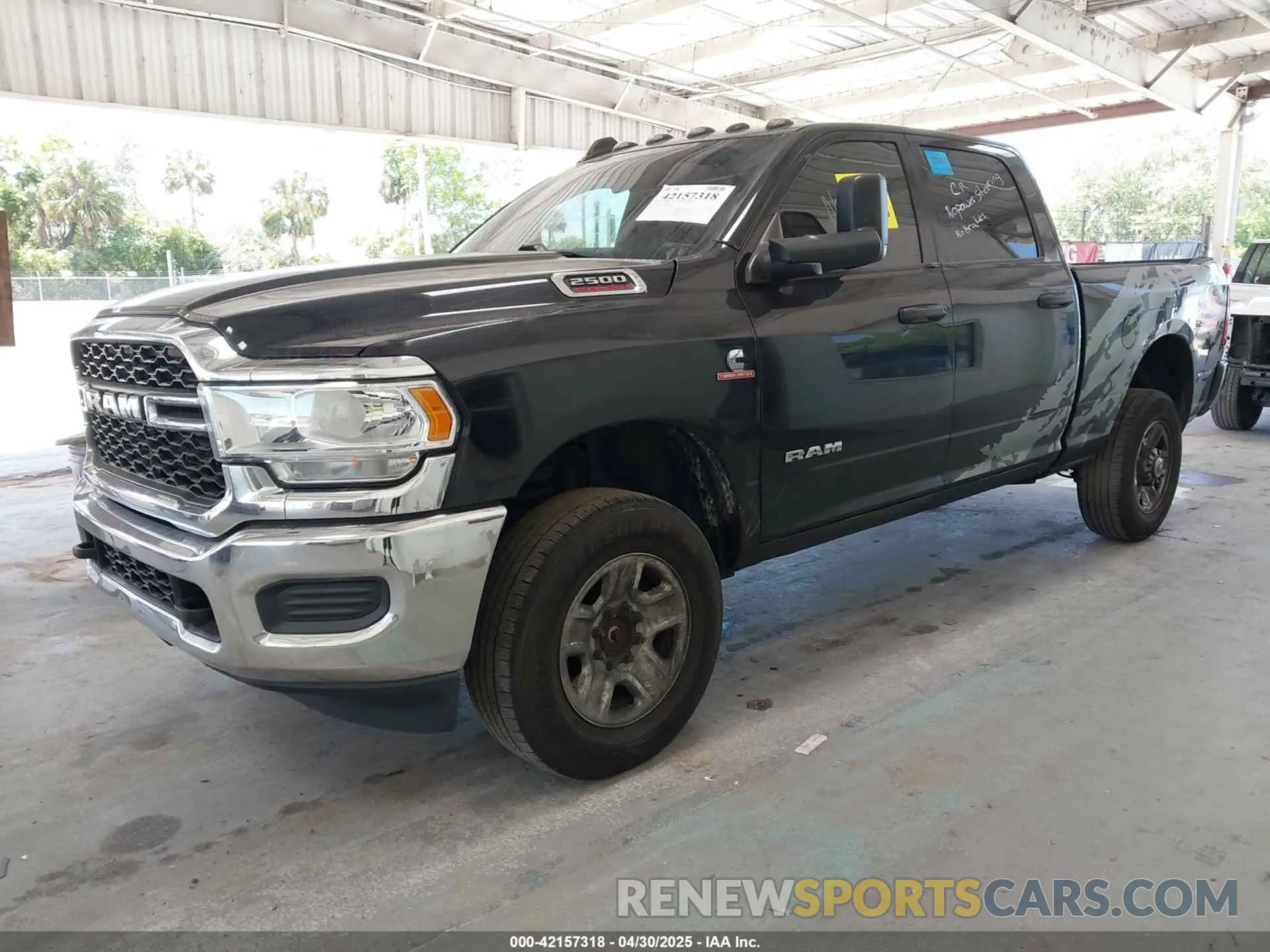 2 Photograph of a damaged car 3C6UR5CL6MG502384 RAM 2500 2021