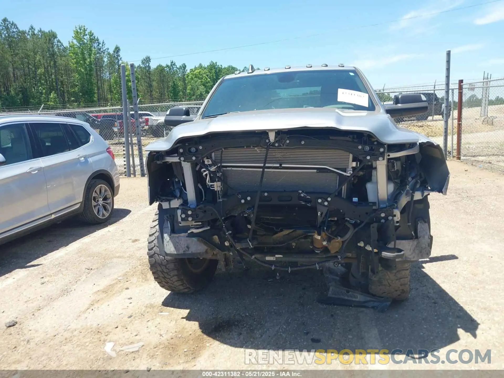 13 Photograph of a damaged car 3C6UR5DJ9MG590554 RAM 2500 2021