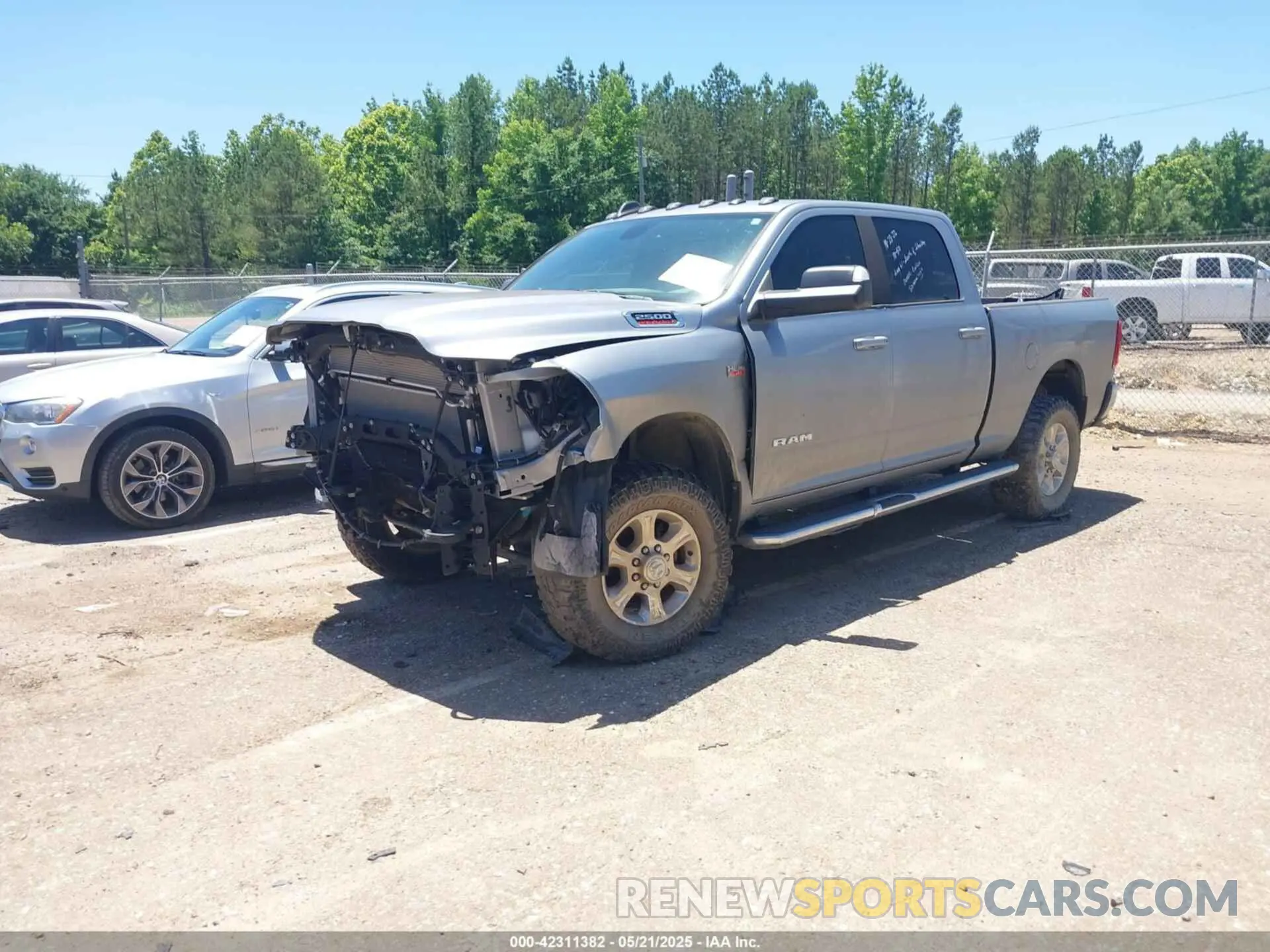 2 Photograph of a damaged car 3C6UR5DJ9MG590554 RAM 2500 2021