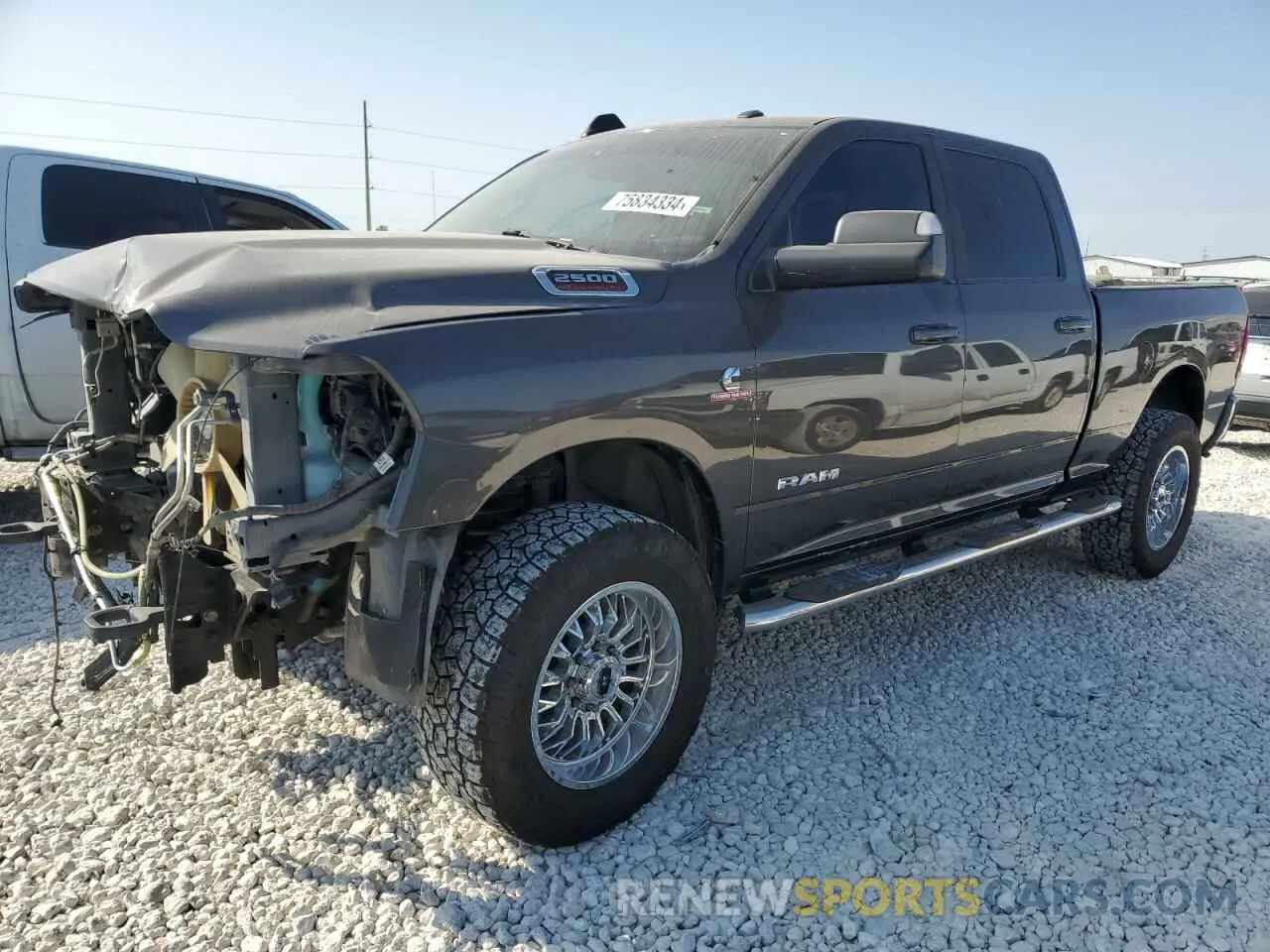 1 Photograph of a damaged car 3C6UR5DL1MG516451 RAM 2500 2021