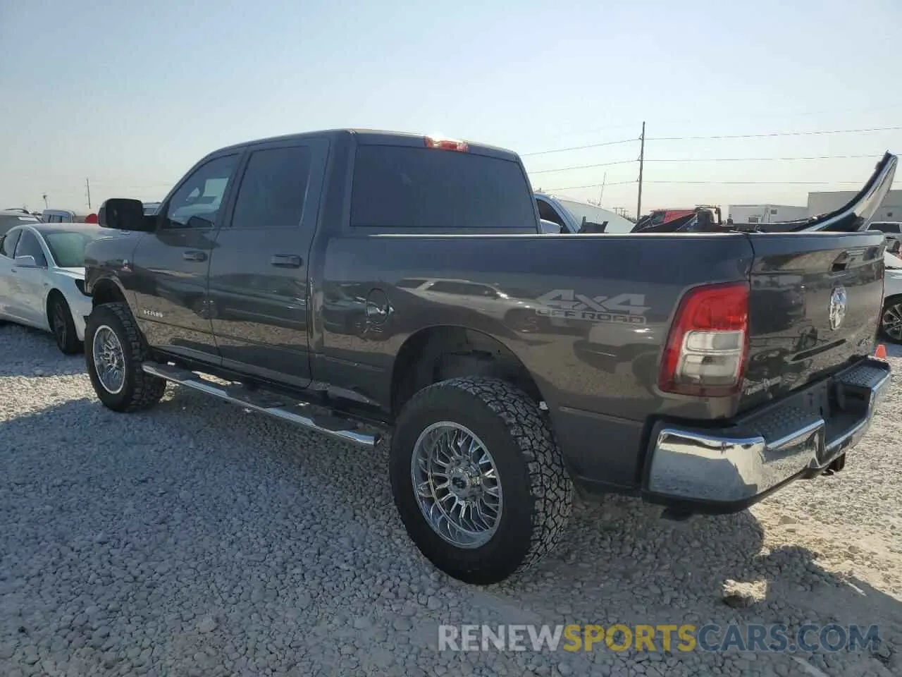 2 Photograph of a damaged car 3C6UR5DL1MG516451 RAM 2500 2021