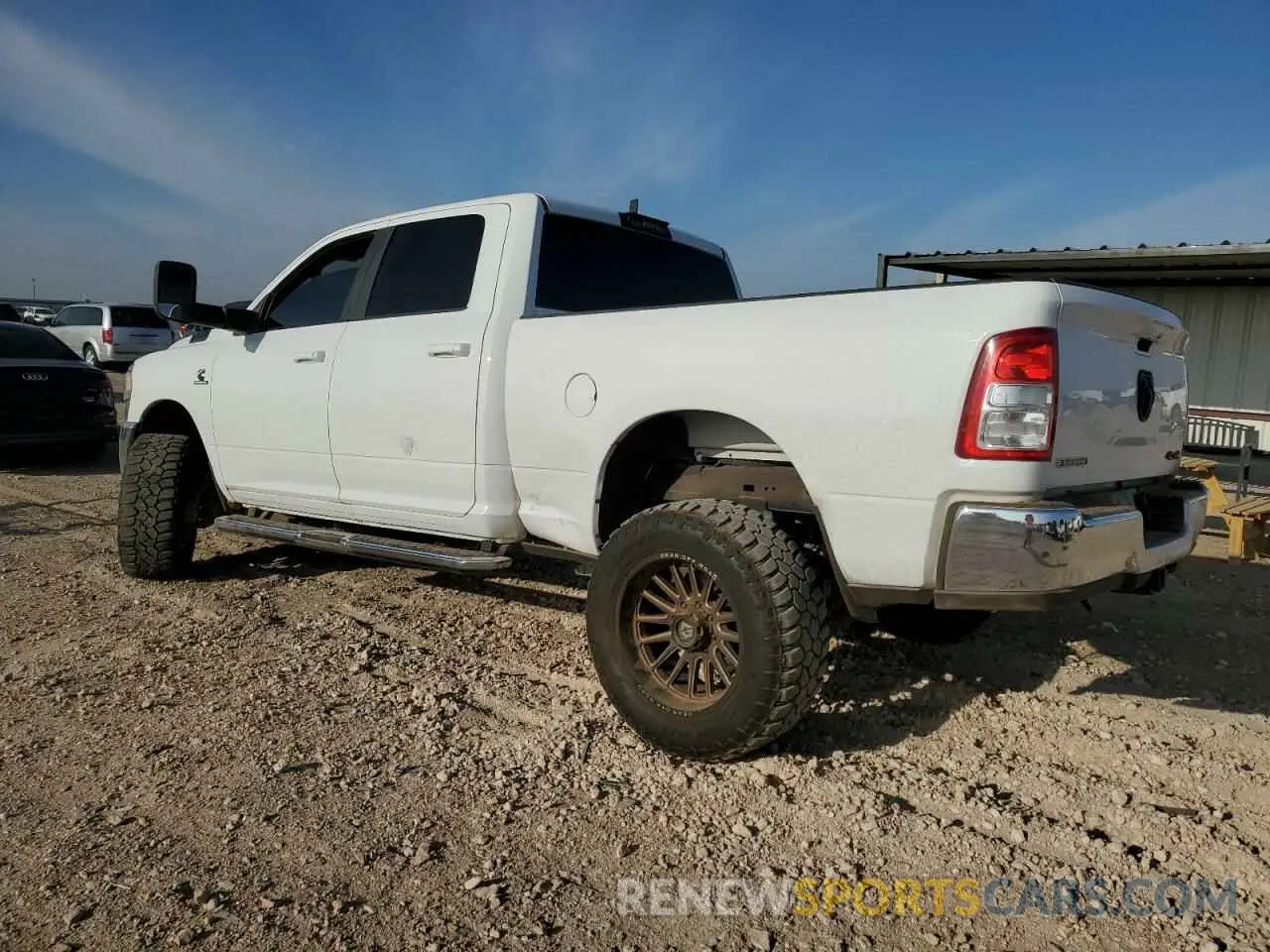 2 Photograph of a damaged car 3C6UR5DL2MG555372 RAM 2500 2021