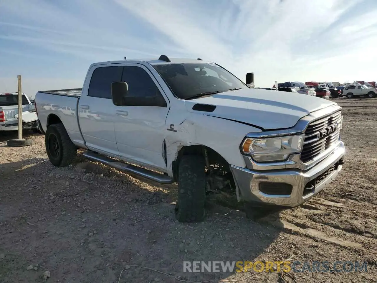 4 Photograph of a damaged car 3C6UR5DL2MG555372 RAM 2500 2021