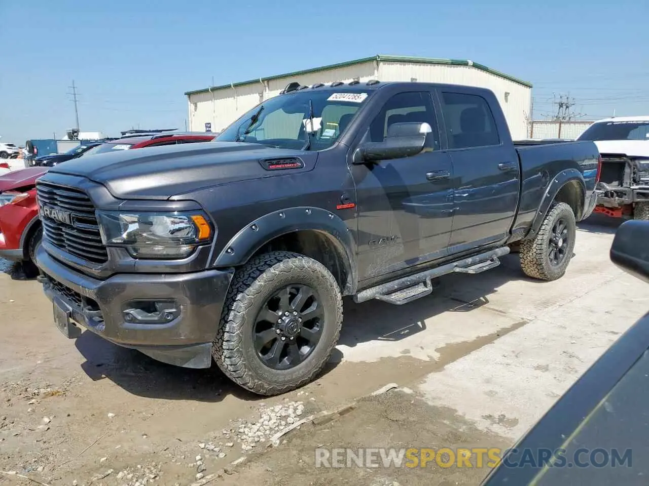 1 Photograph of a damaged car 3C6UR5DL3MG560774 RAM 2500 2021