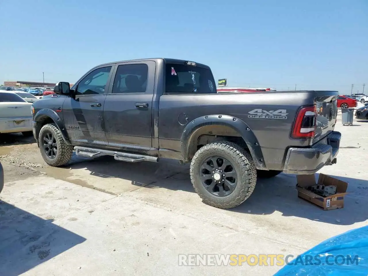 2 Photograph of a damaged car 3C6UR5DL3MG560774 RAM 2500 2021