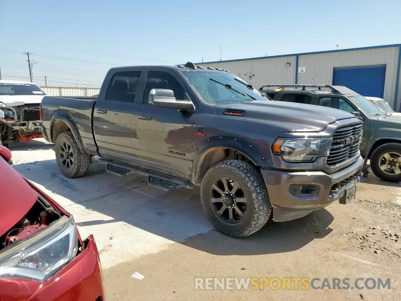 4 Photograph of a damaged car 3C6UR5DL3MG560774 RAM 2500 2021