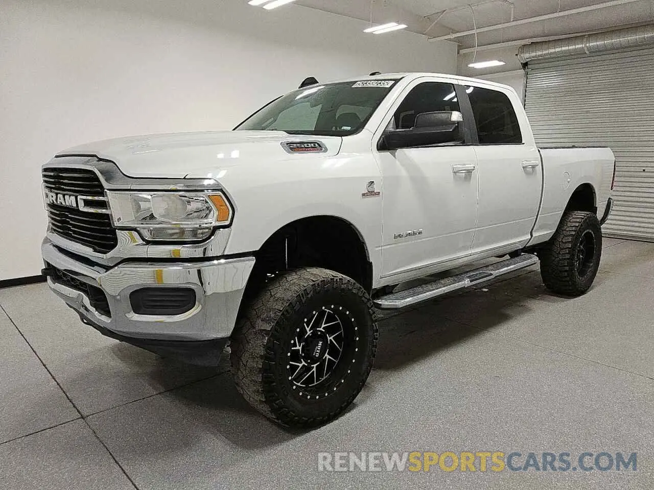 1 Photograph of a damaged car 3C6UR5DL7MG542214 RAM 2500 2021