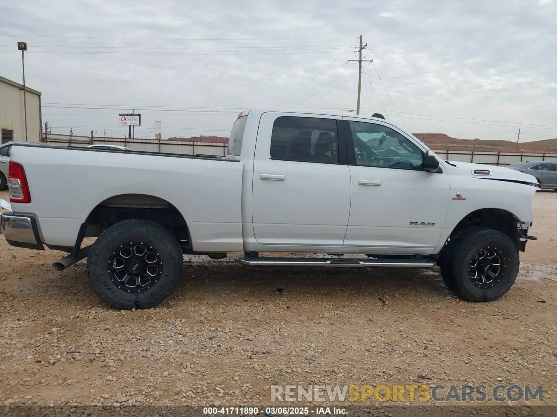 14 Photograph of a damaged car 3C6UR5DL8MG605823 RAM 2500 2021