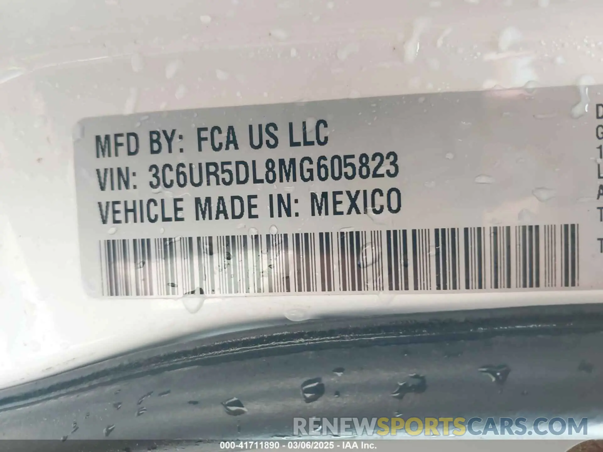 9 Photograph of a damaged car 3C6UR5DL8MG605823 RAM 2500 2021