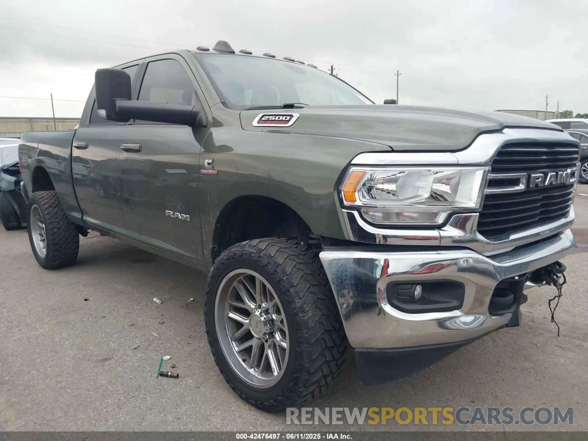 1 Photograph of a damaged car 3C6UR5DL8MG654830 RAM 2500 2021