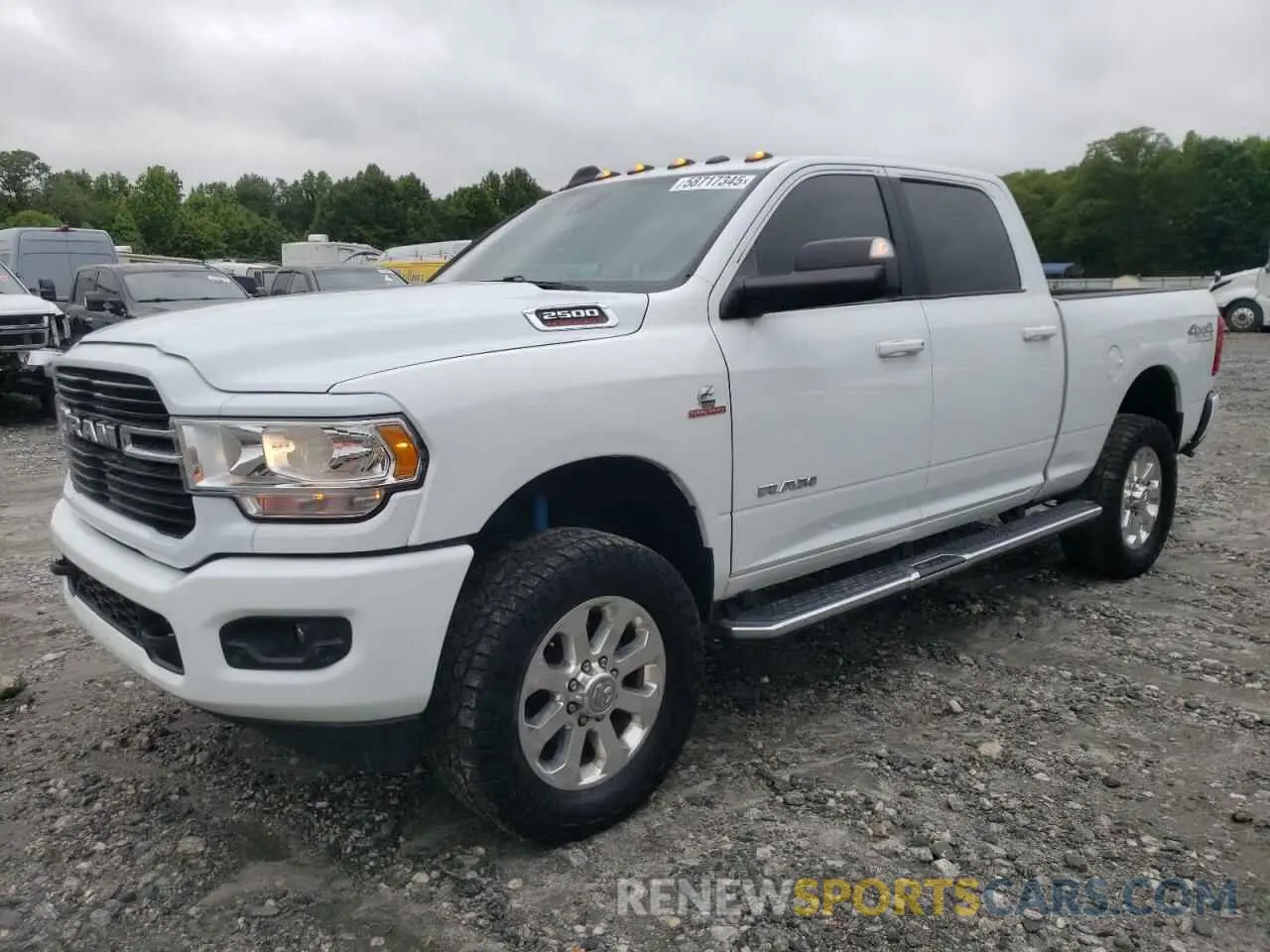 1 Photograph of a damaged car 3C6UR5DL9MG511028 RAM 2500 2021