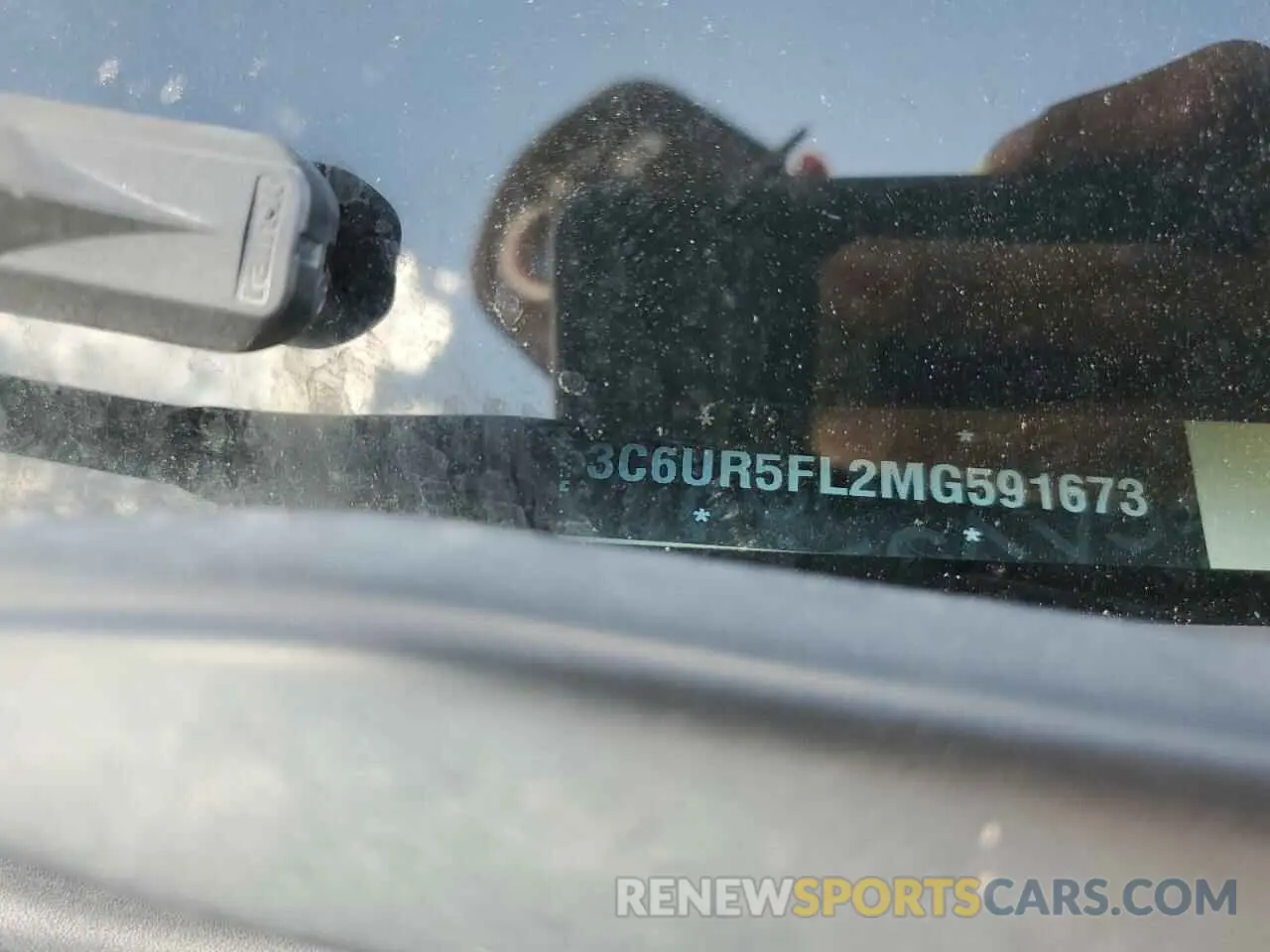 13 Photograph of a damaged car 3C6UR5FL2MG591673 RAM 2500 2021