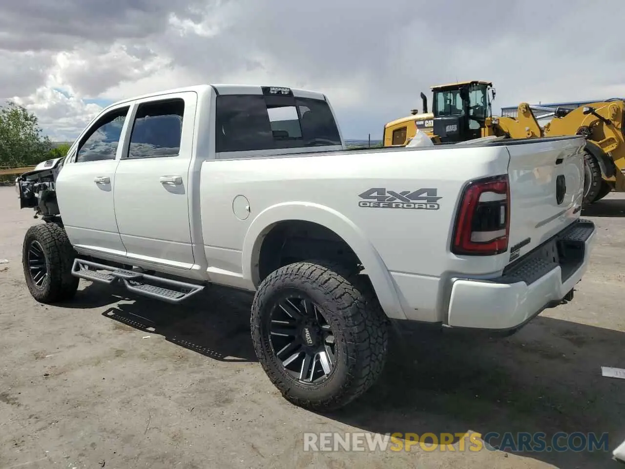 2 Photograph of a damaged car 3C6UR5FL2MG591673 RAM 2500 2021