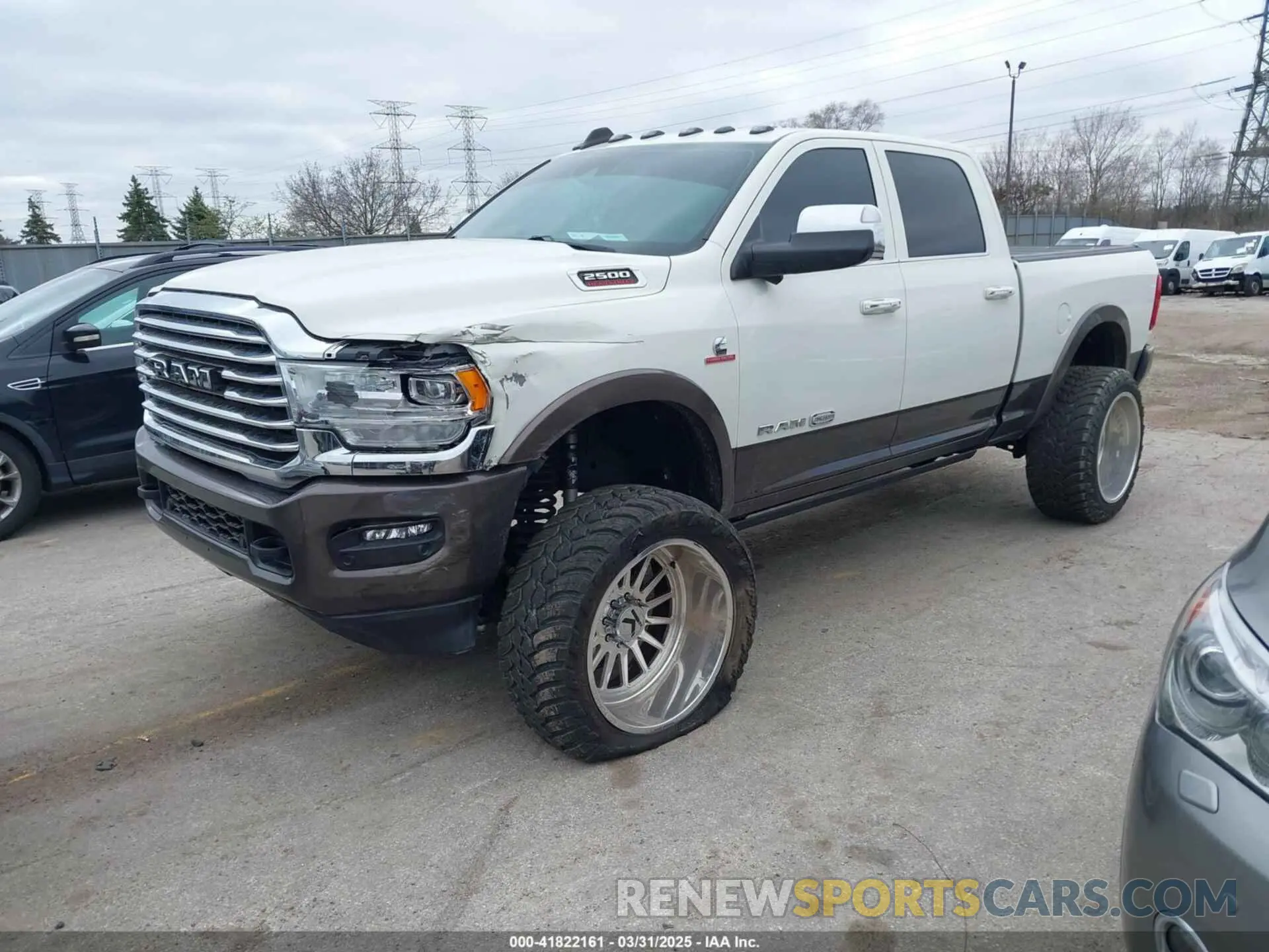 2 Photograph of a damaged car 3C6UR5GL7MG557307 RAM 2500 2021
