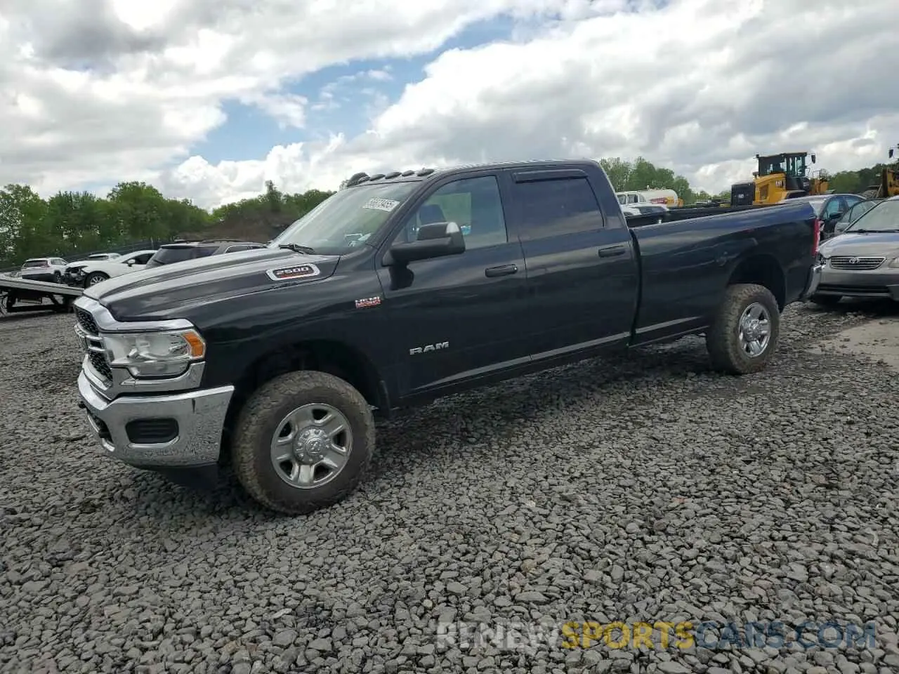 1 Photograph of a damaged car 3C6UR5HJXMG632935 RAM 2500 2021