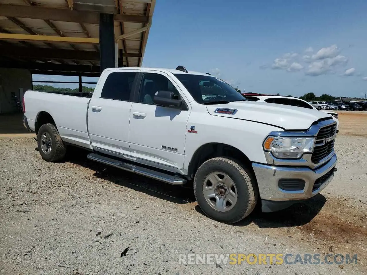 4 Photograph of a damaged car 3C6UR5JL0MG542107 RAM 2500 2021