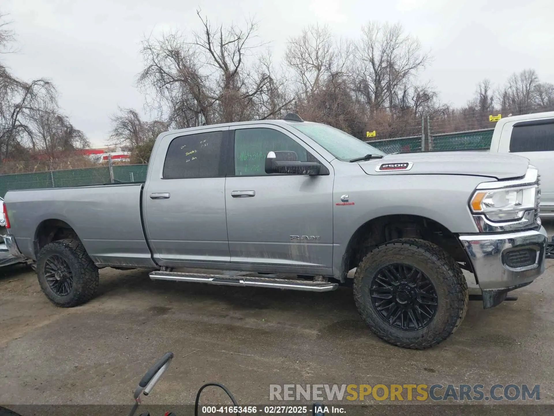 14 Photograph of a damaged car 3C6UR5JL4MG653548 RAM 2500 2021