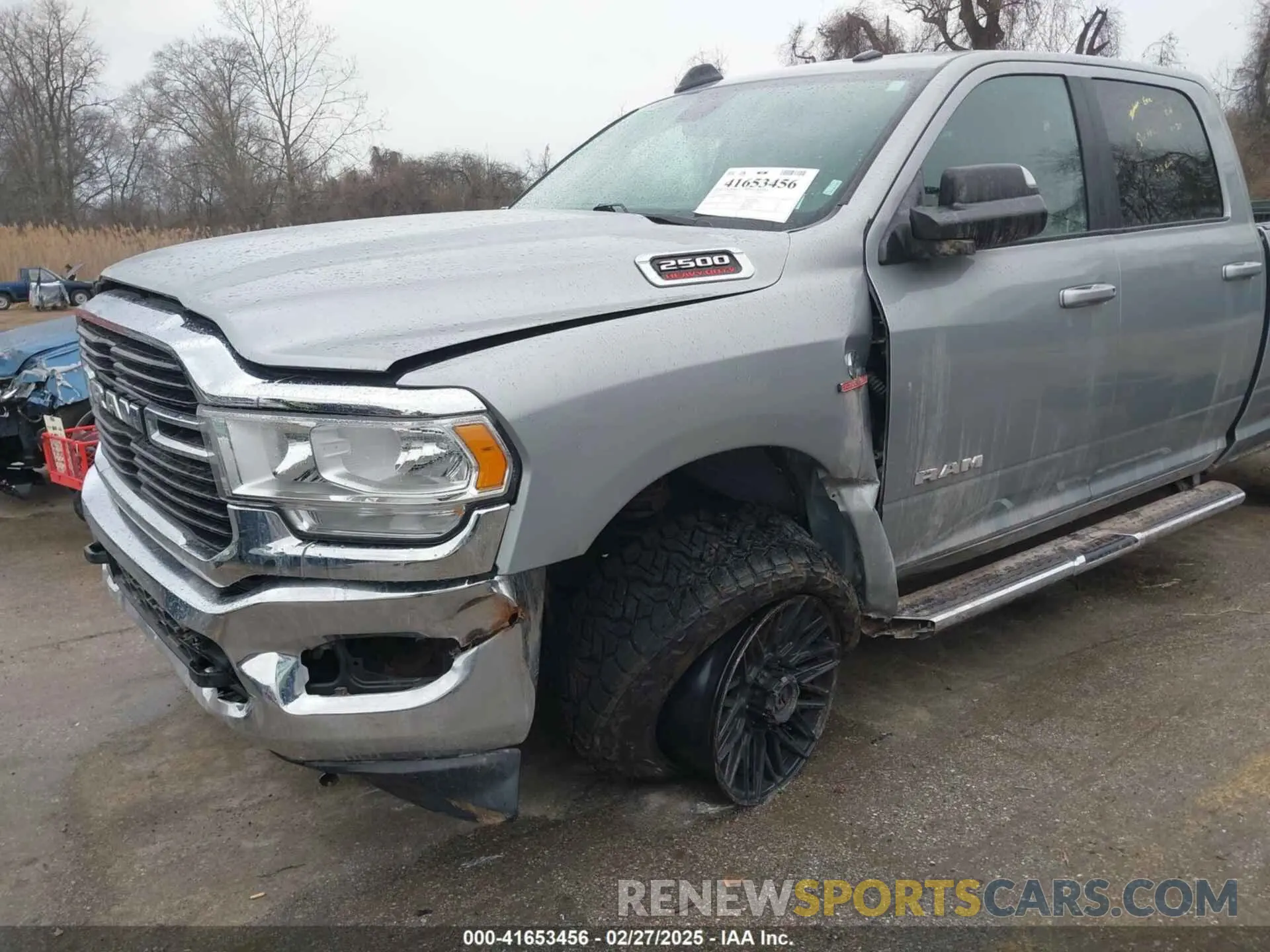 6 Photograph of a damaged car 3C6UR5JL4MG653548 RAM 2500 2021