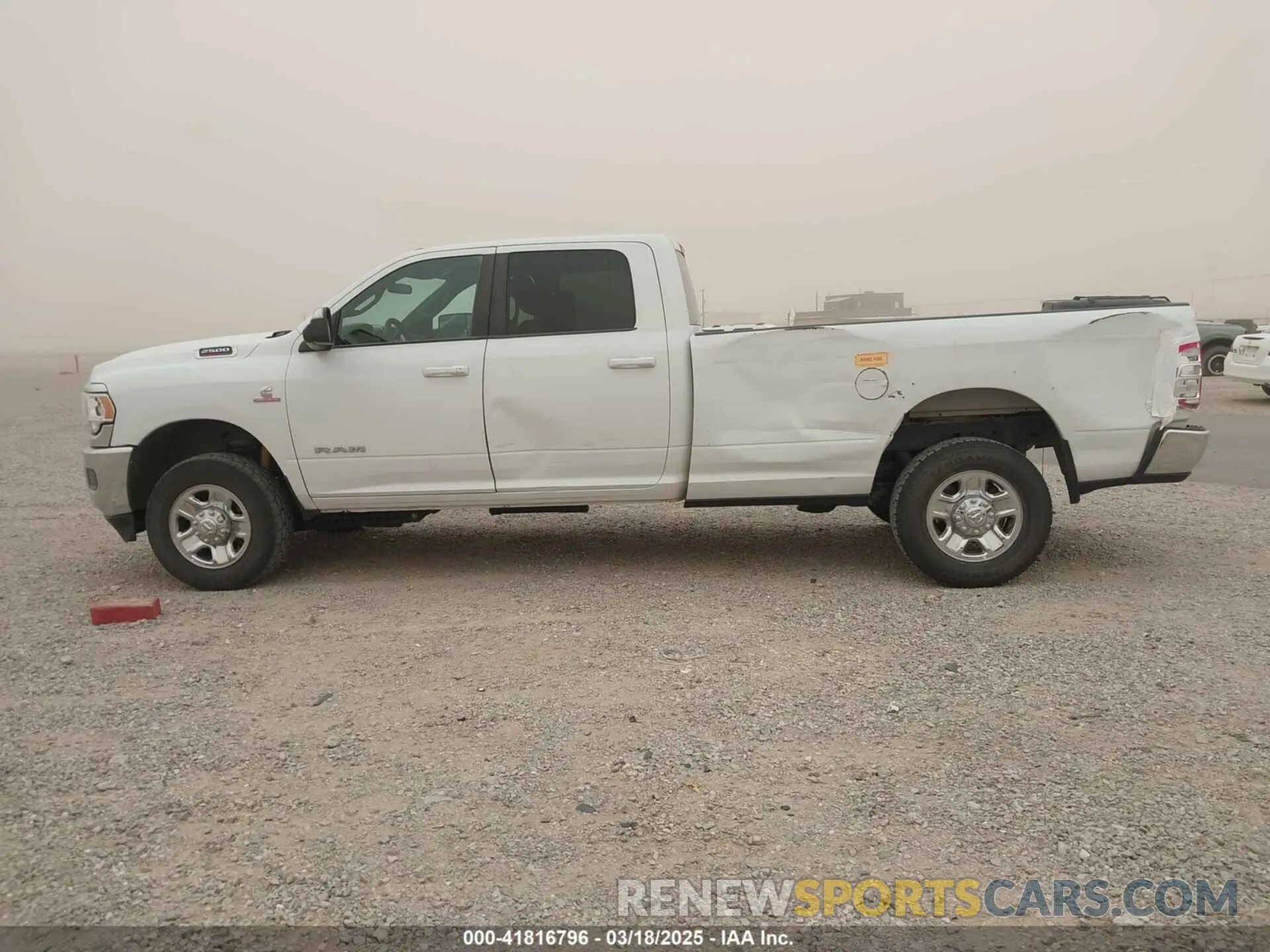 14 Photograph of a damaged car 3C6UR5JLXMG542406 RAM 2500 2021