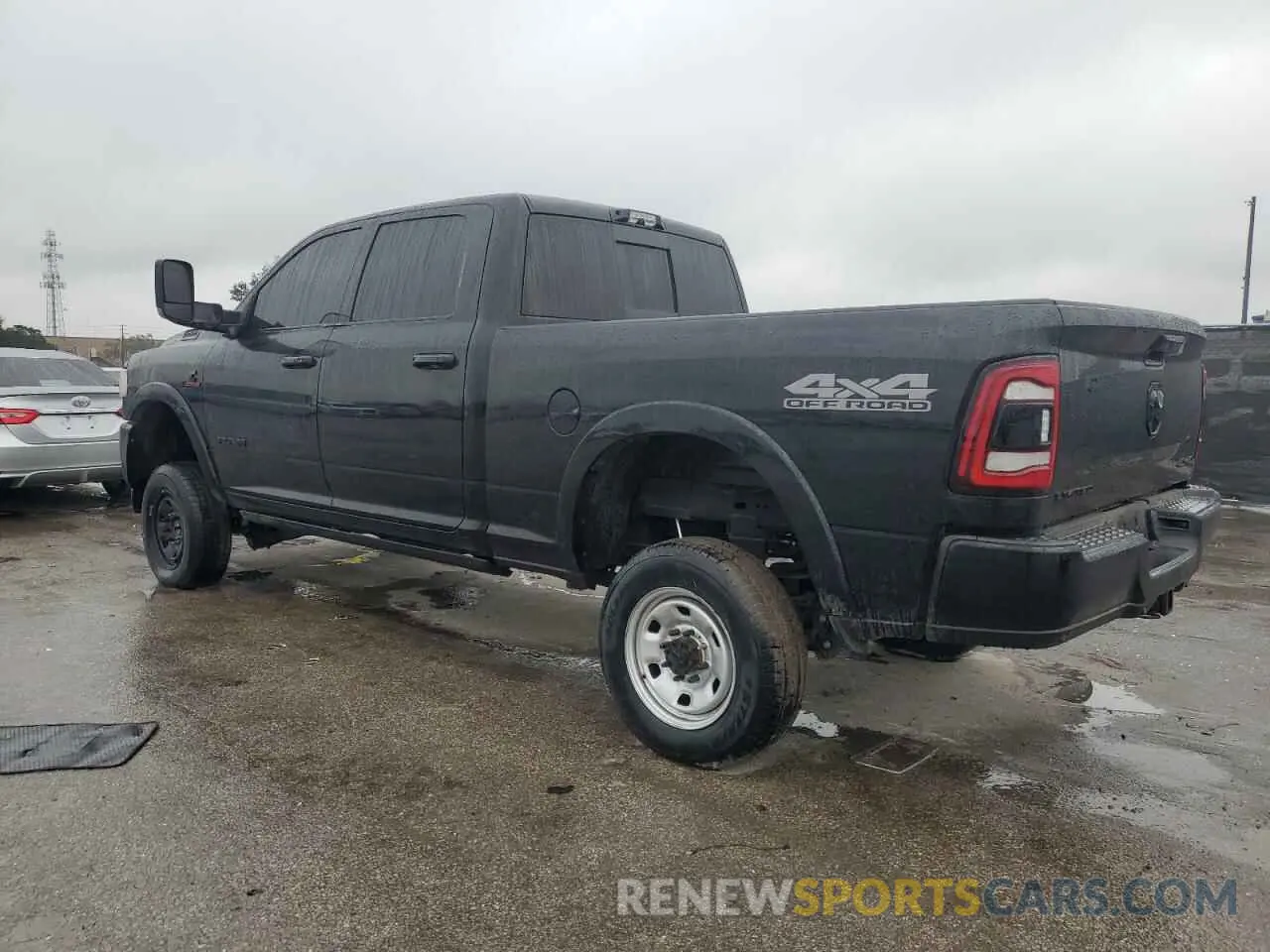 2 Photograph of a damaged car 3C6UR5SL1MG678633 RAM 2500 2021