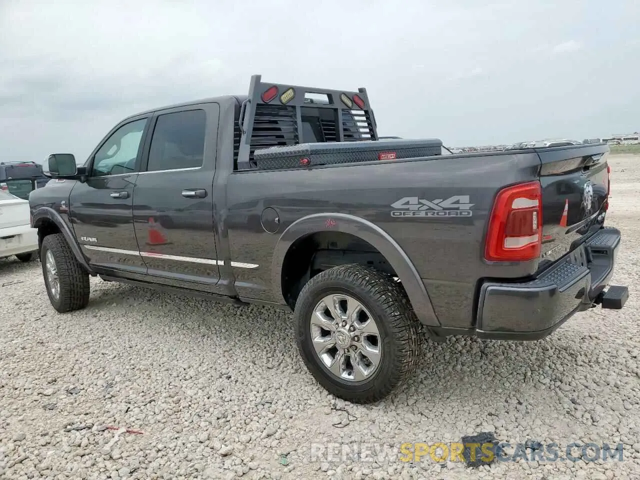2 Photograph of a damaged car 3C6UR5SL3MG674681 RAM 2500 2021