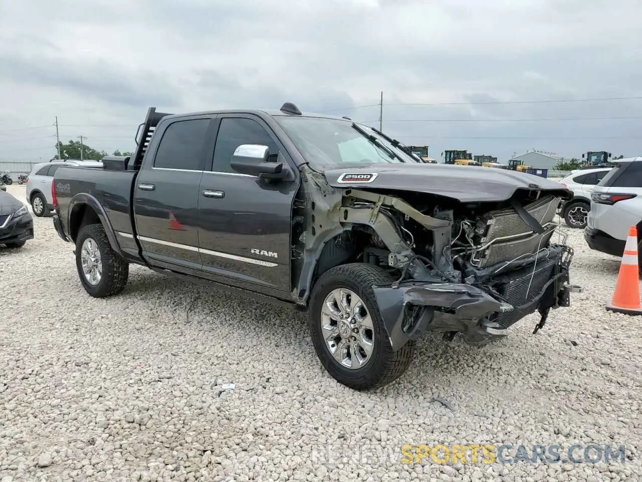 4 Photograph of a damaged car 3C6UR5SL3MG674681 RAM 2500 2021