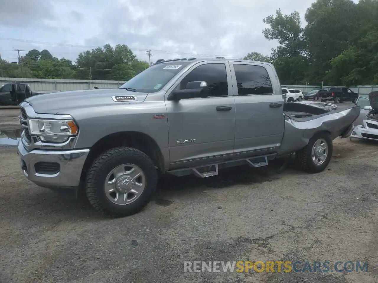 1 Photograph of a damaged car 3C6UR5CJ2NG108459 RAM 2500 2022