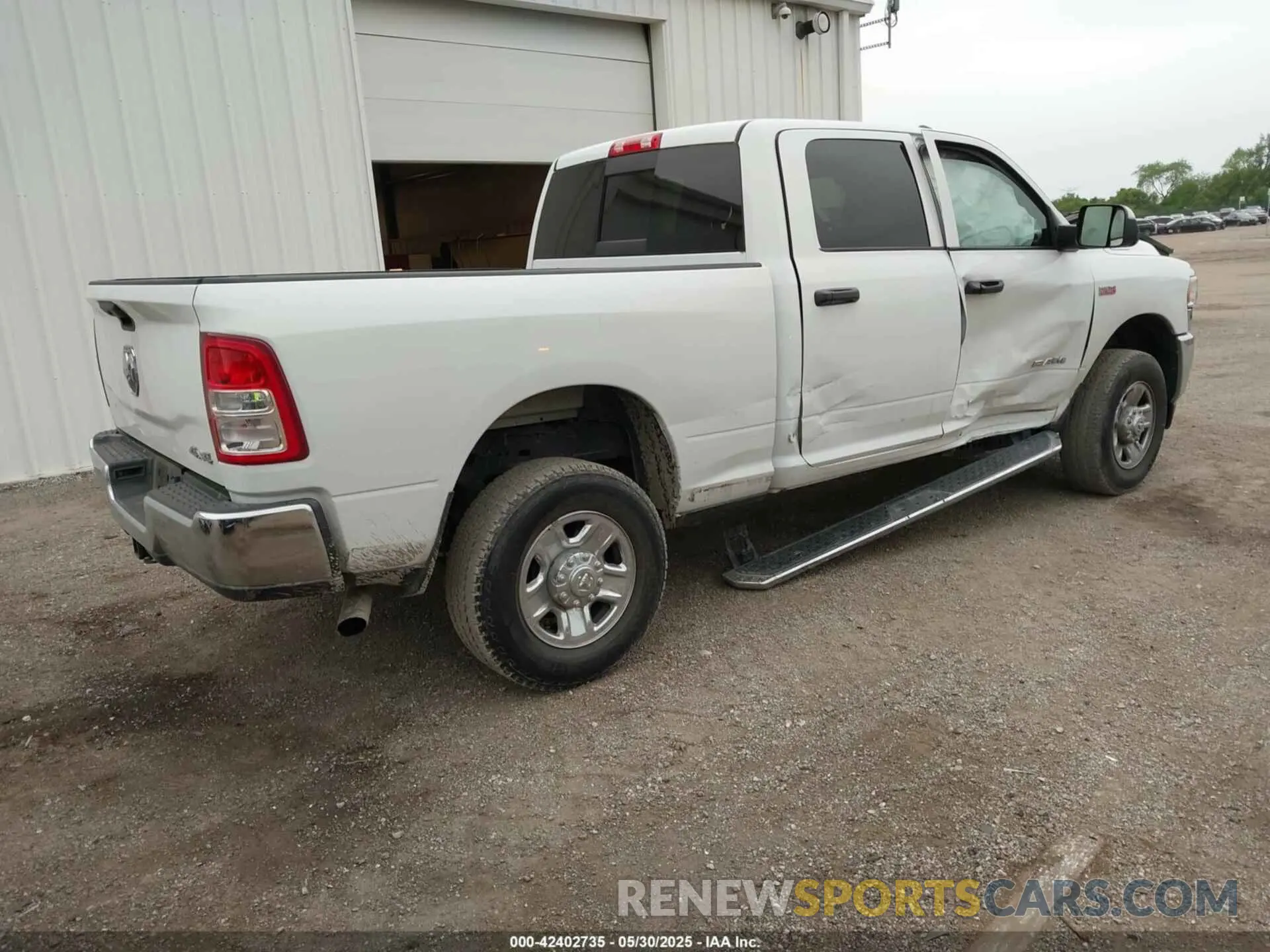 4 Photograph of a damaged car 3C6UR5CJ2NG150131 RAM 2500 2022
