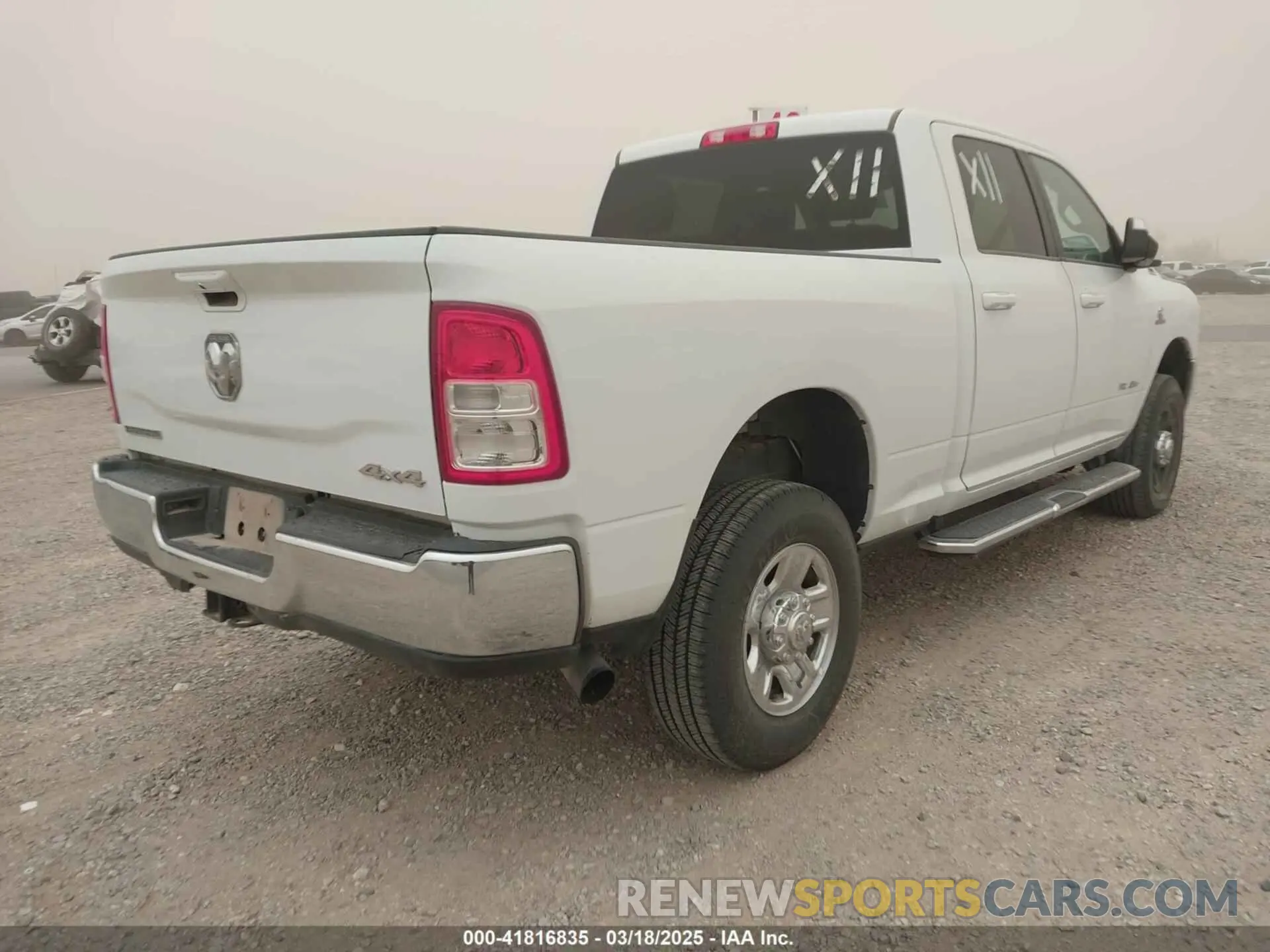 4 Photograph of a damaged car 3C6UR5DL1NG235817 RAM 2500 2022