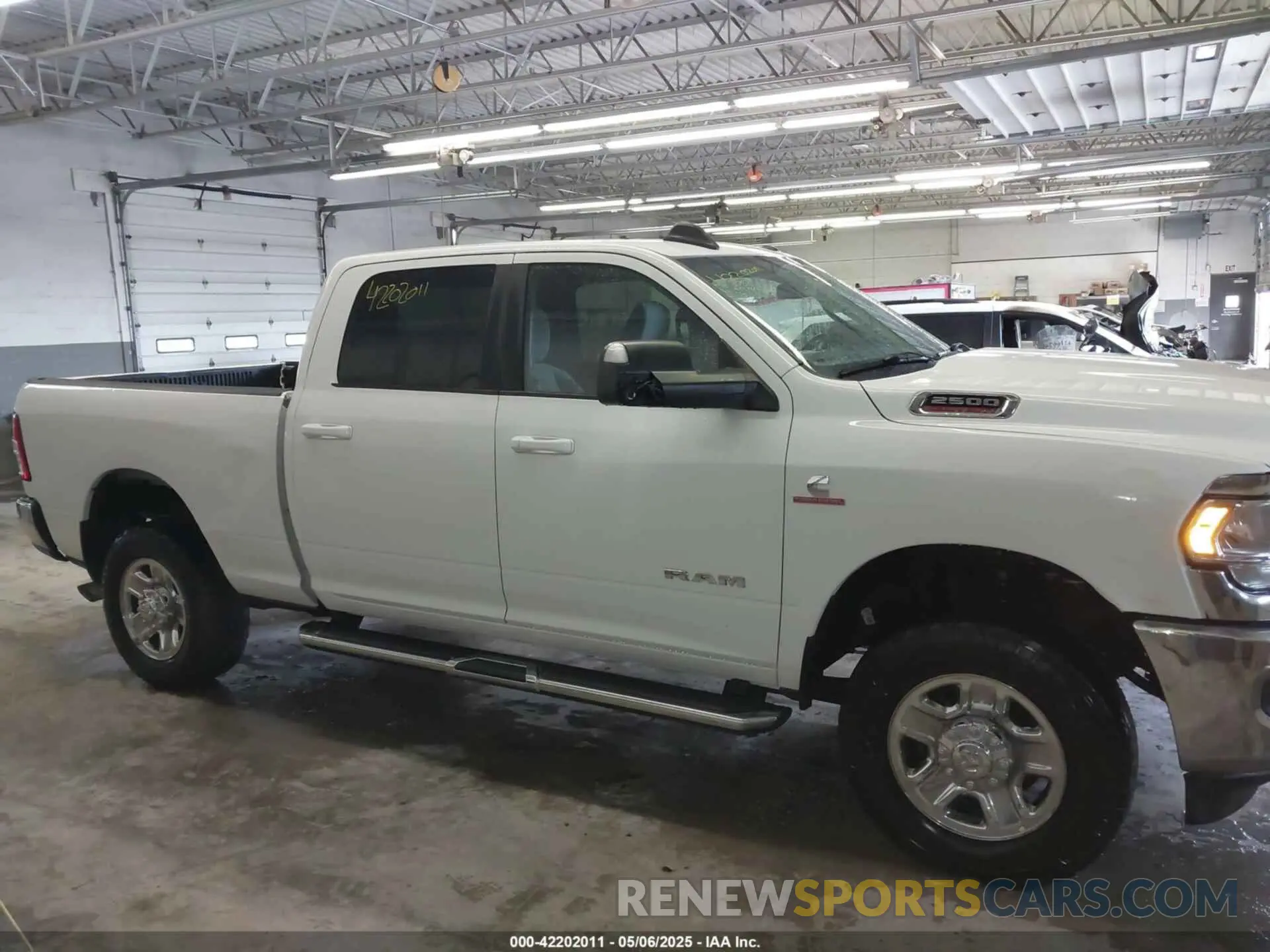 13 Photograph of a damaged car 3C6UR5DL1NG436374 RAM 2500 2022