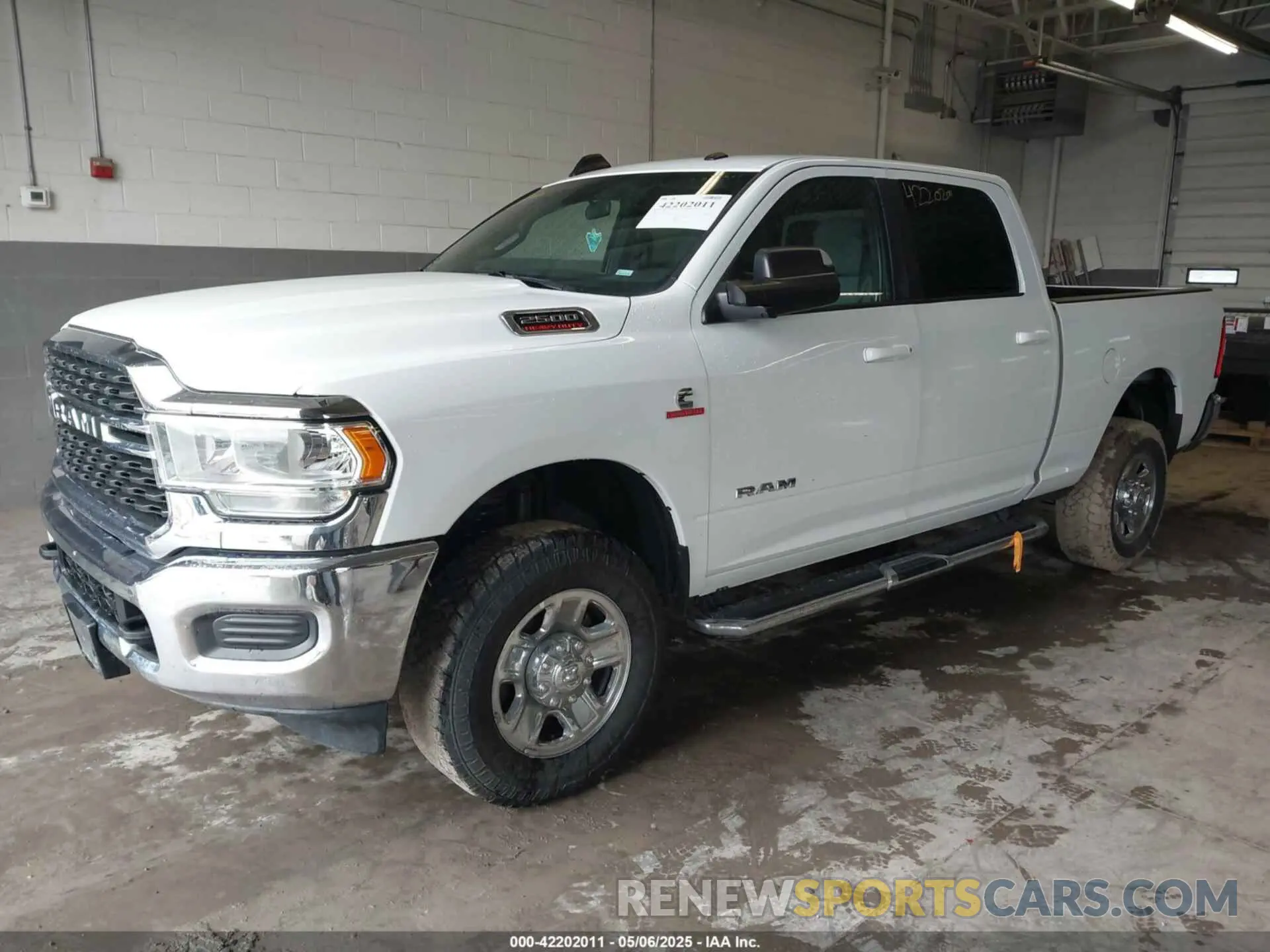 2 Photograph of a damaged car 3C6UR5DL1NG436374 RAM 2500 2022