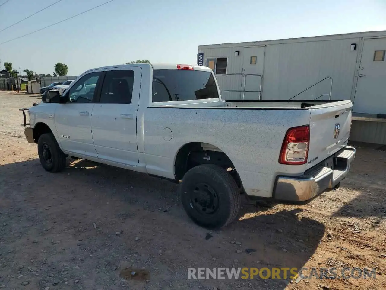 2 Photograph of a damaged car 3C6UR5DL3NG322697 RAM 2500 2022