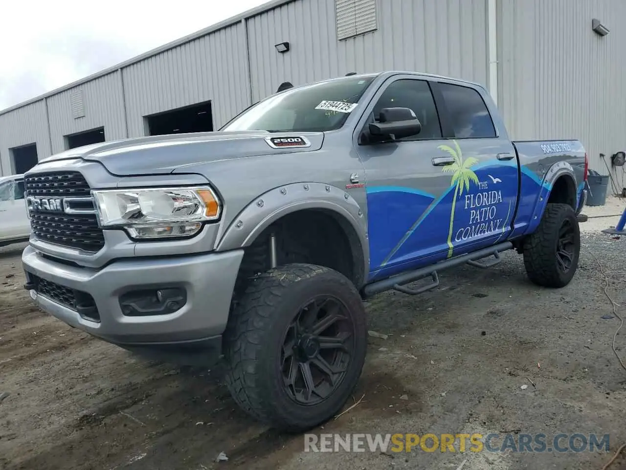 1 Photograph of a damaged car 3C6UR5DL4NG105952 RAM 2500 2022