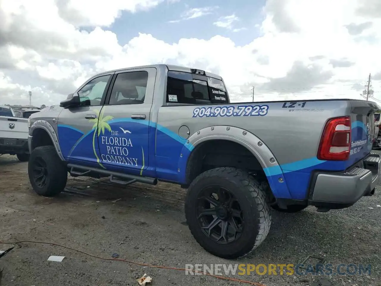 2 Photograph of a damaged car 3C6UR5DL4NG105952 RAM 2500 2022