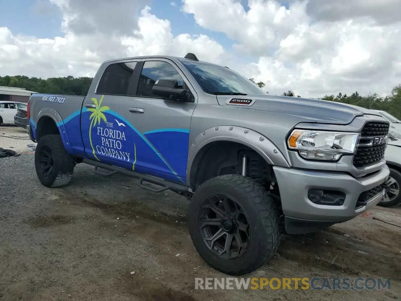 4 Photograph of a damaged car 3C6UR5DL4NG105952 RAM 2500 2022