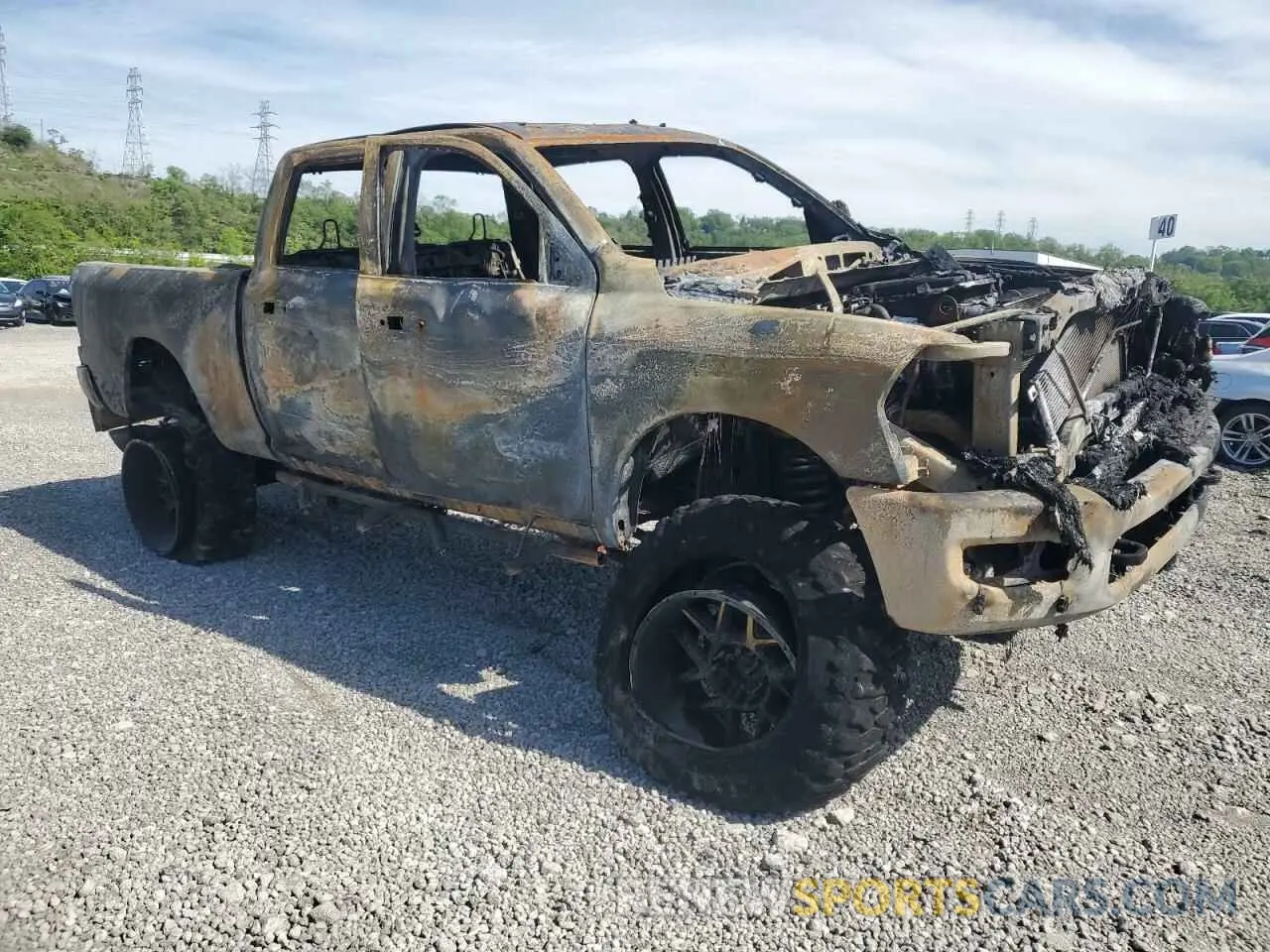 4 Photograph of a damaged car 3C6UR5DL8NG262772 RAM 2500 2022