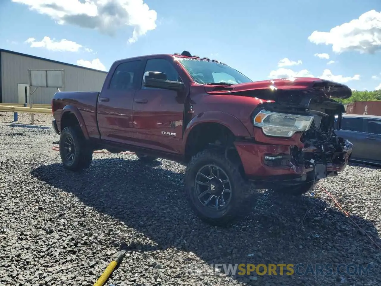 4 Photograph of a damaged car 3C6UR5DL9NG185880 RAM 2500 2022